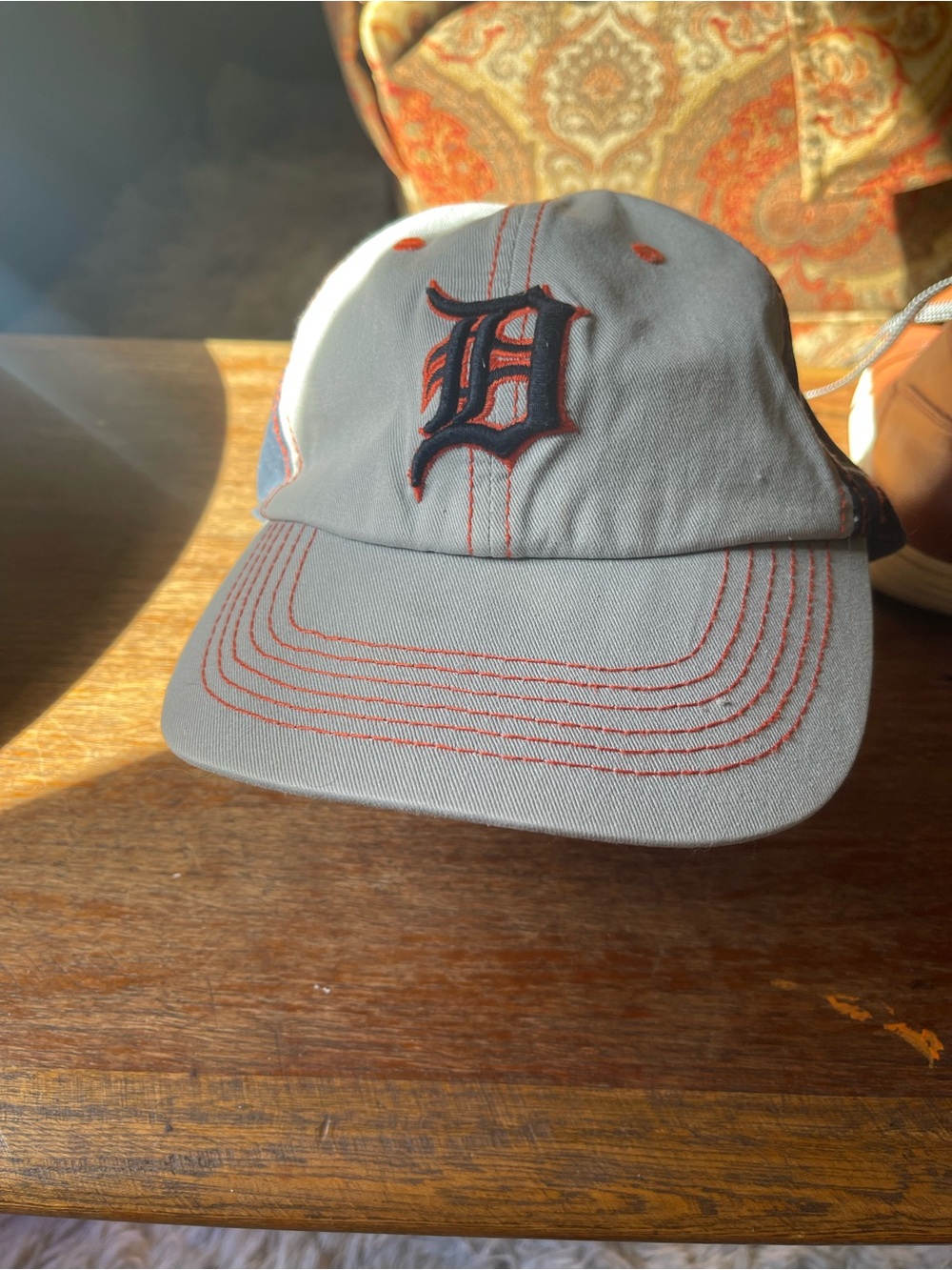 Genuine Merchandise Black Cap with Orange Stitching